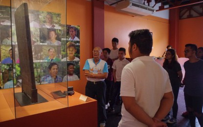<p>Henry Yaplito, 64, a retired overseas Filipino worker, orients visitors at the Taoid Museum in Laoag City. <em>(Photo courtesy of PGIN-CMO)</em></p>