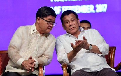 <p>Former justice secretary Vitaliano Aguirre II and President Rodrigo Duterte. <em>(File photo)</em></p>