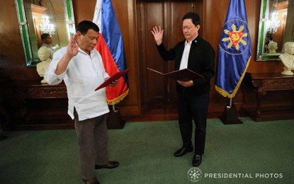 <p><strong>NEWLY APPOINTED SOJ.</strong> President Rodrigo R. Duterte administers the oath of ad interim Secretary of Justice Menardo Guevarra during a ceremony at the Malacañang Palace on April 5, 2018. <em>(Ace Morandante/Presidential Photo)</em></p>