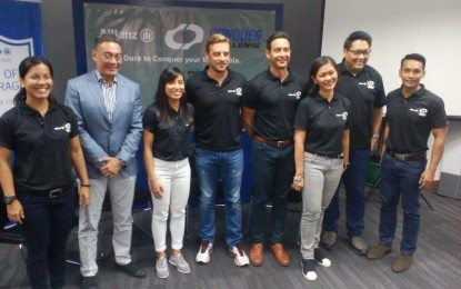 <p>Pilipinas Obstacle Sports Federation President Al Agra (2nd from left), Alex Grenz (4th from left), Allianz PNB Life chief operating officer, and officials of Conquer Challenge Philippines and Allianz Philippines pose for a photo during the event launch in Makati City on Friday (April 6, 2018). <em>(Photo by Ivan Saldajeno)</em></p>