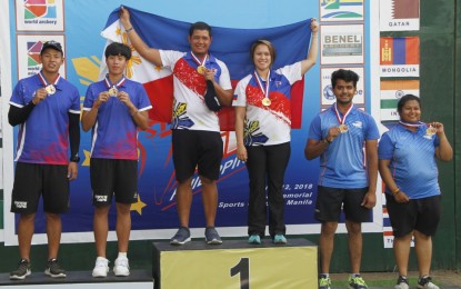 <p><strong>PINOY POWER.</strong> Paul Marton de la Cruz and Amaya Amparo Cojuangco with the other medalists during the awarding ceremony of the compound mixed team event in the 2018 Asia Cup - Stage 2 archery competition at the Rizal Memorial baseball field on Wednesday (April 11, 2018). <em>(PNA photo by Jess Escaros)</em></p>