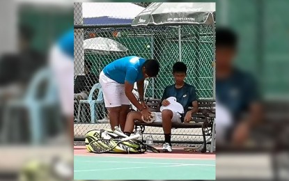 <p>Michael Francis Eala II with coach Patrick John Tierro during Saturday's match against India. <em>(Photo courtesy: Michael Francis Eala)</em></p>