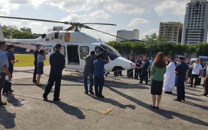 <p><strong>NEW HELICOPTER. </strong>Outgoing PNP Chief Ronald dela Rosa and other police officials board the test flight of one of three brand new multi-role helicopters purchased for the PNP on Monday (April 16, 2018). <em>(Photo by Benjamin Pulta)</em></p>