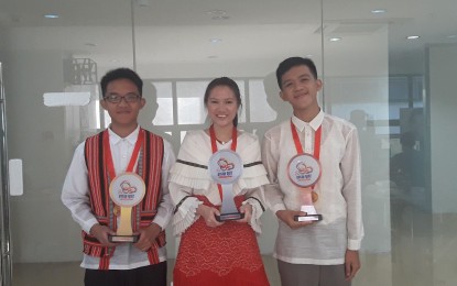 <p>From left to right: ASEAN quiz bee winners Jericho Villarico, champion; Wynkqui Anne Cruz, second runner-up; and Kim Eric Delicano, third runner-up.</p>