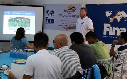 <p><strong>SWIMMING COACH.</strong> World renowned coach Fernando Alves Possenti (standing) discusses open water swimming during his seminar at the Pacific Cebu Resort Hotel on Sunday, April 29, 2018.<em> (Photo courtesy of Philippine Swimming, Inc.)</em></p>