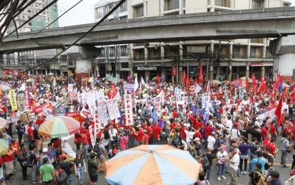 <p><strong>LABOR DAY RALLY. </strong>Various groups calling for the end of contractualization march towards Mendiola in Manila as part of Labor Day protests on Tuesday, May 1, 2018. <em>(PNA photo by Avito C. Dalan)</em></p>