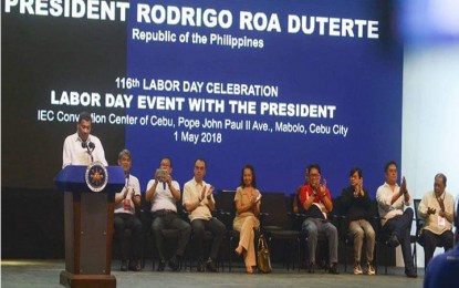 <p style="margin: 0in 0in 7.9pt 0in;"><strong>LABOR DAY WITH THE PRESIDENT. </strong> President Rodrigo R. Duterte addresses the crowd gathered for the 116th Labor Day celebration in Cebu City at IC3 Convention Center on Tuesday (May 1, 2018). Other government officials join the President on stage. <em>(Photo by Bebie Jane Casipong/PNA)</em></p>
<p style="margin: 0in 0in 7.9pt 0in;"> </p>
<p style="margin: 0in 0in 7.9pt 0in;"> </p>
