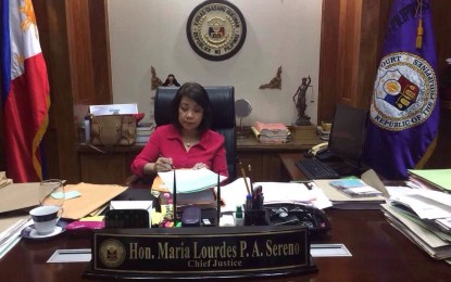 <p><strong>BACK TO WORK. </strong>Chief Justice Maria Lourdes Sereno signs documents submitted to her office upon returning to the Supreme Court after going on indefinite leave for more than two months on Wednesday (May 9, 2018) <em>(Photo courtesy: Staff of Chief Justice Maria Lourdes Sereno)</em></p>