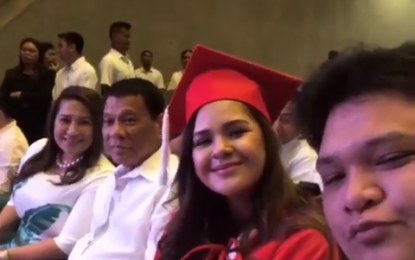 <p>Isabelle Duterte is all smiles in her senior high school graduation ceremony, donning a red cap and gown as shown in a screenshot grabbed from her Instagram account on Thursday (May 17, 2018). </p>