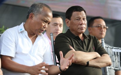 <p>President Rodrigo R. Duterte listens to the briefing given by Energy Secretary Alfonso Cusi during the inauguration of the 420-MW Pagbilao Unit 3 Power Project in Pagbilao, Quezon on May 31, 2018. <em>(Presidential Photo) </em></p>