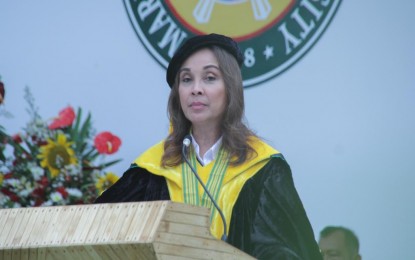 <p><strong>FREE COLLEGE EDUCATION.</strong> Senator Loren Legarda vows to allot an additional PHP40 billion for the implementation of the free tertiary education this year under Republic Act 10931, during the 40th Commencement Exercise of Mariano Marcos State University in Batac City, Ilocos Norte on Friday (June 8, 2018).<em> (Photo by Leilanie Adriano)</em></p>