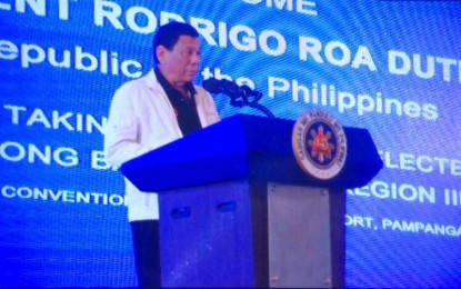 <p><strong>HELP OF THE BARANGAYS SOUGHT.</strong> President Rodrigo Duterte, in his speech at the ASEAN Convention Center in Pampanga on Tuesday (June 12, 2018), asks the help of newly-elected punong barangays to help end the drug menace. <em>(Photo by Marna Dagumboy Del Rosario)</em></p>
<p> </p>