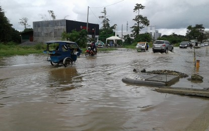 <p>File photo shows the flooded North National Highway in Barangay San Jose, Puerto Princesa City, in October 2017. </p>