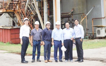 <p>Officials of Philippine Phosphate Fertilizer Corporation and G. S. Gupta pose in one of Philphos buildings shortly after assessing the damage caused by Typhoon Yolanda.</p>