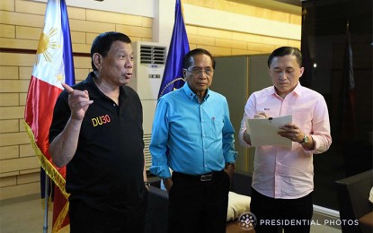 <p>President Rodrigo R. Duterte, Presidential Peace Adviser Jesus Dureza, and Special Assistant to the President Christopher "Bong" Go <em>(Presidential Photo)</em></p>