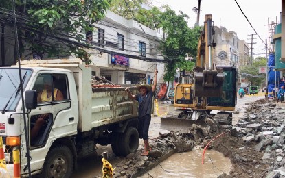 <p><strong>BORACAY ROADWORKS.</strong> Amid a rainy weather, DPWH personnel continue clearing the roads as part of the ongoing rehabilitation of Boracay, aiming to finish the works in time for the closed top tourist destination's set reopening in October. <em>(Photo by Cindy Ferrer)</em></p>