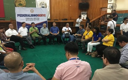 <p>DILG Assistant Secretary Jonathan Malaya (speaking, in green shirt) together with other federalism experts conduct a dialogue with basic sectors of Albay during the "Pederalismoserye" town hall meeting at Sangguniang Panlalawigan Hall on Friday. <em>(Photo by Connie Calipay)</em></p>