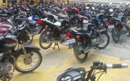 <p><strong>IMPOUNDED.</strong> Police seized on Tuesday (July 10, 2018) 132 questionable vehicles, the bulk of which were motorcycles, in Pikit, North Cotabato following a reported increase in robbery-snatching and drive-by shooting cases in the locality the past several weeks. <em><strong>(Photo courtesy of Jess M. Ali - DXMY Cotabato)</strong></em></p>