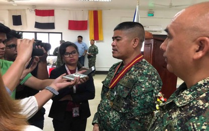 <p style="text-align: left;"><strong>CHANGE OF COMMAND IN PALAWAN:</strong> Brigadier General Nathaniel Casem (wearing medal and in uniform) and Col. Charlton Sean Gaerlan are being interviewed by the local media during their change of command late Wednesday afternoon (June 11, 2018) at the 3rd Marine Brigade Headquarters in Barangay Tiniguiban. <em>(Photo by Celeste Anna R. Formoso)</em></p>