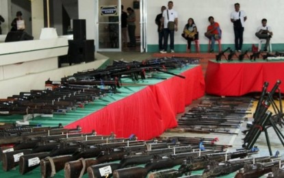 <p><strong>SURRENDER.</strong> Some 250 loose firearms collected from their respective constituent by local executives of the towns of Aleosan, Pigcawayan, Libungan, and Kabacan, all in North Cotabato, were presented Thursday (July 19, 2018) at the provincial capitol gymnasium in Kidapawan City for a formal turnover to the military under the government’s “Balik Baril” program. <em><strong>(Photo courtesy of DXND - Kidapawan)</strong></em></p>