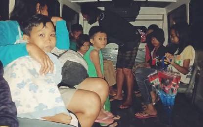 <p><strong>EVACUEES.</strong> Young children with their parents residing in flooded Barangay Sampinit in Bago City, Negros Occidental were evacuated by rescue personnel on Sunday night. <em>(Photo from Bago DRRM Facebook account)</em></p>
<p> </p>