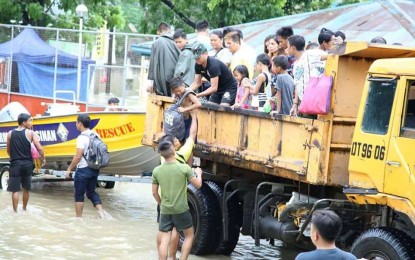 <p>STATE OF CALAMITY. Personnel of intergovernment agencies assist in rescue operations in severely flooded areas in Pangasinan, which has been declared under a state of calamity. <em><strong>(Photo courtesy of Provincial Government of Pangasinan) </strong></em></p>
