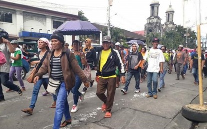 <p><strong>RALLY IN BACOLOD CITY. </strong>Participants of the march-rally led by militant group Bayan-Negros passing by Rizal Street before converging at Bacolod public plaza on Monday afternoon. <em>(Photo courtesy of Raquel Gariando) </em></p>