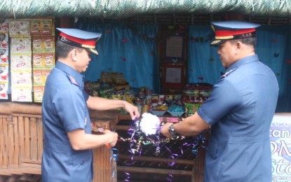 <p><strong>HONESTY STORE.</strong> Senior Supt. Chito Bersaluna, acting provincial director of Bulacan Police Provincial Office (left) with Supt. Ferdinand Germino, force commander of the 1st Bulacan Provincial Mobile Force Company during the ceremonial ribbon cutting of 'Honesty Store' inside the Camp Gen. Alejo S. Santos on Monday (July 23, 2018). <em>(Photo by Manny Balbin)</em></p>