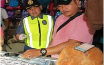 <p>SHABU IN STUFFED TOY.<strong> </strong>Bacoor City chief of police Supt. Vicente Cabatingan inspects the 47 sachets of suspected “shabu” that were concealed inside a stuffed toy seized during a buy-bust operation at the Zapote public market in Bacoor City on July 25, 2018. <em>(Photo by Bacoor City PNP)</em></p>