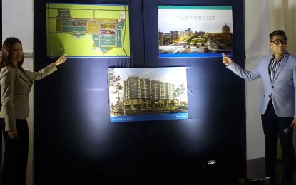 <p>Harold Geronimo (right), Megaworld senior assistant vice president and head of public relations and media affairs, and Rachelle Peñaflorida, Megaworld Bacolod vice president for sales and marketing, present the master plan for The Upper East, including the nine-storey One Regis residential condominium, during a press conference in Bacolod City on Monday. <em>(Photo by Nanette L. Guadalquiver)</em></p>
<p> </p>