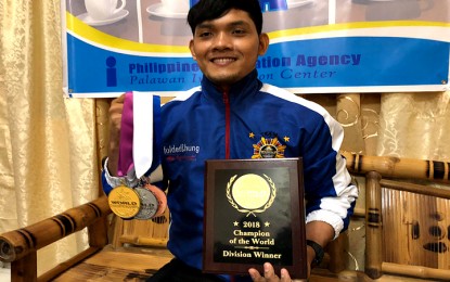 <p><strong>WCOPA WINNER:</strong> Arjay Espartero shows the medals and plaque he won from the recent World Championship of Performing Arts held in Long Beach, California last July.  <em>(Photo by Celeste Anna R. Formoso)</em></p>