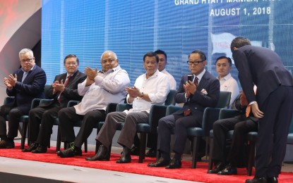 <p><strong>TOYOTA ANNIVERSARY.</strong> President Rodrigo R. Duterte applauds as he witnesses the program proper during the 30th anniversary celebration of Toyota Motor Philippines (TMP) Corporation at the Grand Hyatt Hotel Manila in Bonifacio Global City (BGC), Taguig City on August 1, 2018. Also in the photo are Trade and Industry Secretary Ramon Lopez, Finance Secretary Carlos Dominguez III, Executive Secretary Salvador Medialdea, Toyota Motor Corporation President Akio Toyoda, and Sec. Bong Go of the Office of the Special Assistant to the President. <em>(Alfred Frias/Presidential Photo) </em></p>