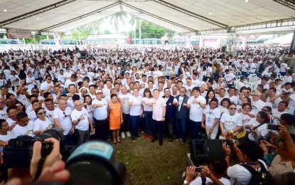 <p>Hugpong ng Pagbabago stalwarts with Special Assistant to the President Christopher Lawrence "Bong" Go, Ilocos Norte Governor Imee Marcos, Senators Cynthia Villar, and JV Ejercito in a groupie following the oath-taking of new party members in Tagum City, Davao del Norte province on Friday. <em>Lilian C Mellejor/PNA</em></p>