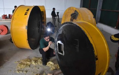 <p>PDEA Director General AAron Aquino inspects one of the four magnetic lifters seized from a warehouse in Cavite. The magnetic lifters believed to have contained an estimated PHP6 billion worth of shabu. <em>(Photo courtesy of DG Aquino Facebook account)</em></p>