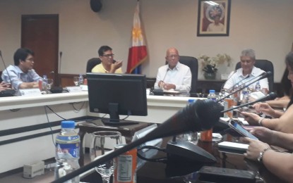 <p>Defense Secretary Delfin Lorenzana answers questions from reporters during a media briefing. <em>(Photo by Priam  Nepomuceno)</em></p>