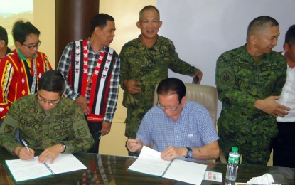 <p>Bukidnon Governor Jose Ma. R. Zubiri Jr. and Brigadier General Eric C. Vinoya, the Army’s 403rd Brigade commander sign the memorandum of agreement declaring Bukidnon Conflict Manageable and Ready for Further Development on August 7 held at the PPDO Conference Room, Capitol Compound, Malaybalay City.<em> (Photo by Mel B. Madera)</em><br /><br /></p>