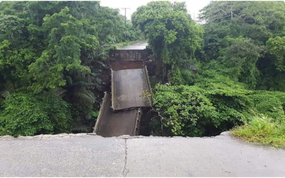 <p><strong>BRIDGE COLLAPSE.</strong> The Esperanza Bridge in Cavite’s upland town of Alfonso collapses as bridge easement and abutment foundation give way due to soil erosion, splitting the 50-meter bridge span in two, at the height of the river surge triggered by heavy rains on Sunday (Aug. 12, 2018). No casualty was reported in the incident and security measures have been placed to warn residents and motorists to ensure their safety and take alternative routes. <em>(Photo courtesy of Alfonso MDRRMO)</em></p>