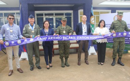<p><strong>NEWLY RENOVATED MILITARY HOSPITAL: </strong>Lt. Gen. Rozzano Briguez (2nd from left), commander of the AFP’s Western Command, holds the ribbon for the inauguration of the newly-refurbished Camp General Artemio Ricarte Station Hospital with Connie Angeles (2nd from right), the assistant vice president and executive director for health and medical program of the SM Foundation. Also in photo are representatives from SM City Puerto Princesa and other military officials of Wescom. The 20-bed capacity infirmary facility is located inside the Wescom Headquarters in Barangay San Miguel, Puerto Princesa City, Palawan.<em>(Photo courtesy of Wescom Public Affairs Office)</em></p>