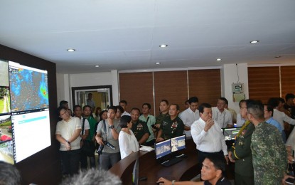 <p><strong>DISASTER TECHNOLOGY.</strong> Governor Wilhelmino Sy-Alvarado shows Armed Forces of the Philippines Chief of Staff General Carlito Galvez Jr. the modern technology being used at the Bulacan disaster management operation center, Wednesday, Aug. 15, 2018. (<em>Photo by Manny Balbin)</em></p>