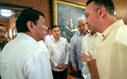 <p><strong>TERM-SHARING DEAL.</strong> President Rodrigo Duterte (left) and House Speaker Alan Peter Cayetano chat in this undated photo. Malacañang on Tuesday (Sept. 22, 2020) said Duterte is still hopeful that Cayetano would honor his term-sharing deal with Marinduque Rep. Lord Allan Velasco. <em>(File photo)</em></p>
