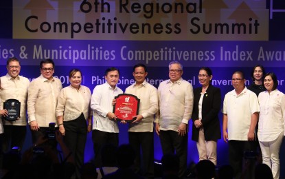 <p><strong>MOST COMPETITIVE CITY.</strong>  Special Assistant to the President Secretary Christopher Lawrence <em>"Bong"</em> Go hands the award to Mayor Noel Rosal of Legazpi City, which was named as the country's Most Competitive City by the National Competitiveness Council (NCC) under the Component City Category, besting 1,200 local government units nationwide. The awarding was held Aug. 16, 2018 at the Philippine International Convention Center. (<em>PNA photo by Joseph Olalia Razon</em>)</p>