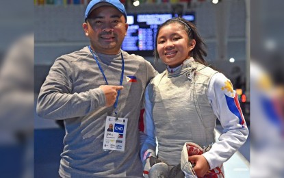 <p><strong>FENCING STANDOUT.</strong> Samantha Kyle Catantan with national coach Rolando Canlas during the Verona Cup in Italy. <em>(Contributed photo)</em></p>