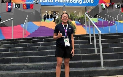 <p><strong>HOPEFUL.</strong> Elien Rose Perez, a member of the Philippine weightlifting team competing in the 18th Asian Games in Jakarta, Indonesia, poses in front of the Athletes Village. <em>(Contributed photo)</em></p>