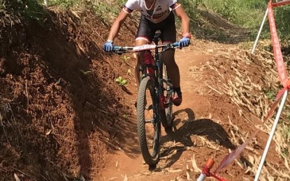 <p><strong>UNLUCKY. </strong>Ariana Dormitorio in action during the women's cross-country event in the 18th Asian Games cycling competition at the Khe Bun Hill in Subang, Indonesia on Tuesday. She crashed in the second of the five-lap race. <em>(Photo by PSC Media Pool)</em></p>