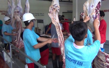 <p>Workers slice the beef of cattle slaughtered by the Filipino-Turkish Tolerance School marking the celebration on Tuesday of the Feast of Sacrifice. The beef slices were distributed to the less fortunate families. <em>(Photo by: Teofilo P. Garcia Jr.) </em></p>