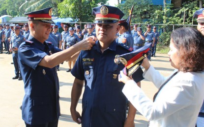 <p><strong>NEWLY-PROMOTED POLICE PERSONNEL:</strong> Senior Supt. Ronnie Francis Cariaga (left), leads the pinning and donning of ranks to newly-promoted personnel of the Puerto Princesa City Police Office (PPCPO) on Monday, August 20, 2018. <em>(Photo courtesy of Tandikan PCR)</em></p>