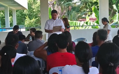 <p><strong>DIALOGUE.</strong> Mr. Alexander James Jaucian, teacher-owner-administrator of Bicol Central Academy (BCA) apologizes and explains his side on last week's bag-burning incident during a dialogue on Wednesday with Department of Education officials, parents and students affected. <em>(Photo by DepEd-Bicol)</em></p>
