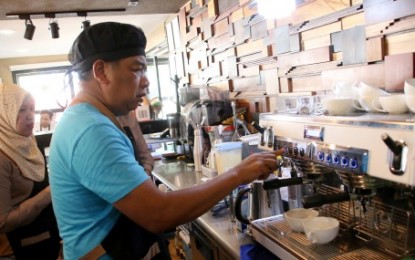 <p><strong>BARISTA GUV.</strong> Autonomous Region in Muslim Mindanao Governor Mujiv Hataman operates a coffee maker machine at Moro Café inside the Shariff Kabunsuan Complex in Cotabato City as part of his Barista course supervised by the ARMM’s Technical Education and Skills Development Authority. The agency later awarded the governor with a National Certificate Level II on “Barista” course after the evaluation test. <em><strong>(Photo courtesy of BPI-ARMM)</strong></em></p>