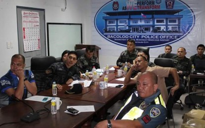 <p><strong>TASK GROUP ATOTUBO.</strong> Senior Supt. Francisco Ebreo (center), acting  police director of Bacolod City, convenes the special investigation task group  assigned to probe murder of lawyer Rafael Atotubo, at the city police headquarters on Friday (August 25, 2018). <em>(Photo courtesy of Bacolod City Police Office)</em></p>
<p> </p>
<p> </p>
<p> </p>