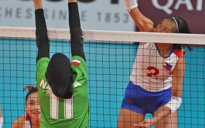 <p><strong>TOP SCORER.</strong> Alyssa Valdez tries to score during the Group A preliminary round match between Philippines and Indonesia in the 18th Asian Games women's volleyball competition at the Gelora Bung Karno Volley Center in Jakarta, Indonesia on Saturday night. Indonesia won, 3-1. <em>(Photo by PSC Media Pool) </em></p>